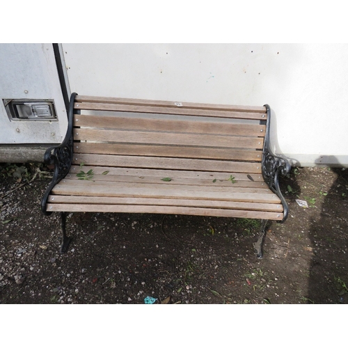 A cast iron and hardwood garden bench