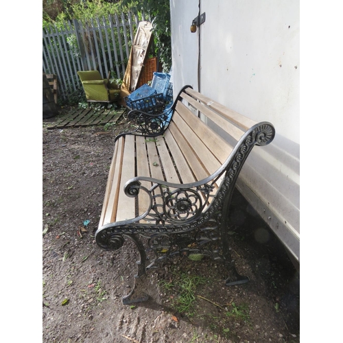 A cast iron and hardwood garden bench