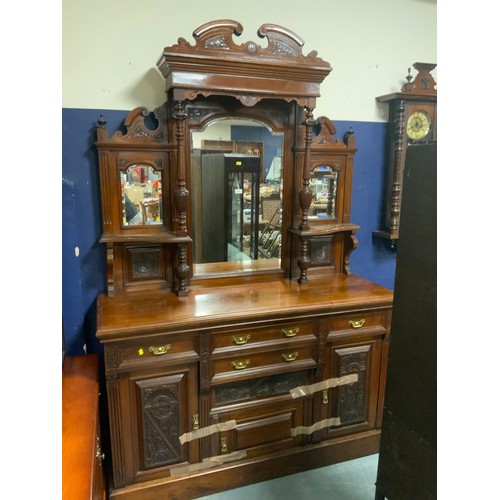 A large Edwardian carved mirror backed sideboard