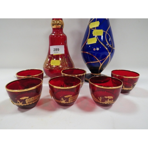 A Murano six glass and decanter set with gold overlay depicting scenes ...