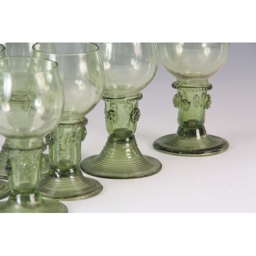 11 - A SET OF EIGHT 19TH CENTURY CONTINENTAL PALE GREEN WINE GLASSES with rounded bowls, prunted stems an... 