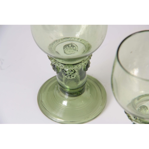 11 - A SET OF EIGHT 19TH CENTURY CONTINENTAL PALE GREEN WINE GLASSES with rounded bowls, prunted stems an... 