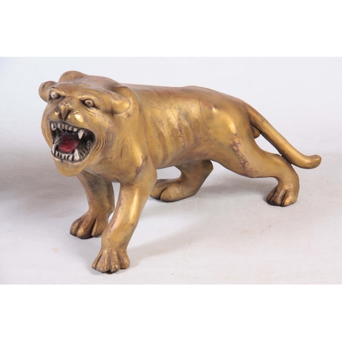 128 - A PAIR OF CARVED GILTWOOD TIGERS.