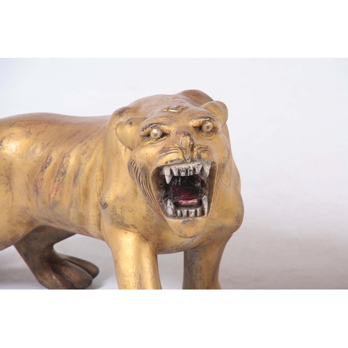 128 - A PAIR OF CARVED GILTWOOD TIGERS.