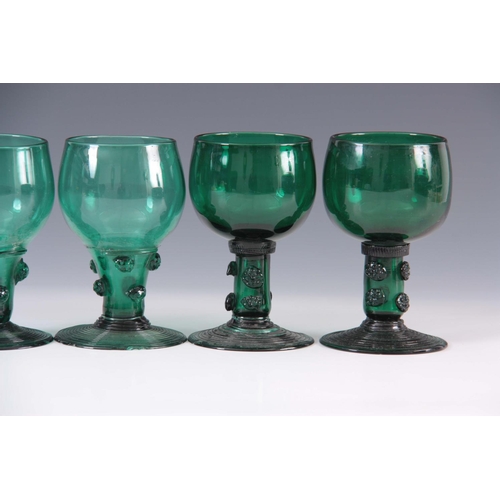 13 - A MATCHED SET OF FOUR 19TH CENTURY BRISTOL GREEN WINE GLASSES with rounded bowls continuing downward... 