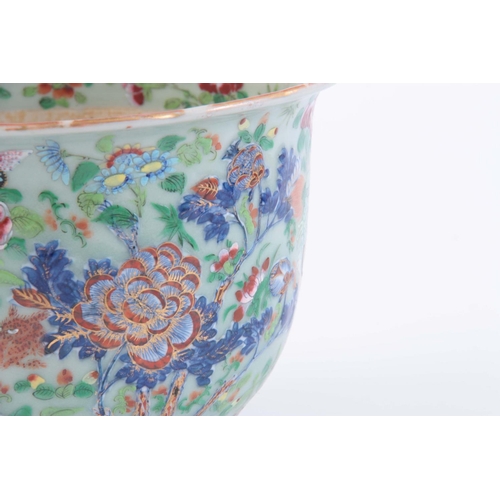 133 - A CHINESE PORCELAIN FAMILLE ROSE JARDINIéRE depicting butterflies and animals on a celadon ground.