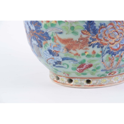 133 - A CHINESE PORCELAIN FAMILLE ROSE JARDINIéRE depicting butterflies and animals on a celadon ground.