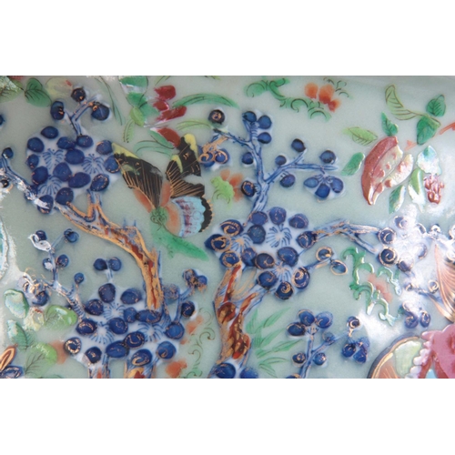 133 - A CHINESE PORCELAIN FAMILLE ROSE JARDINIéRE depicting butterflies and animals on a celadon ground.