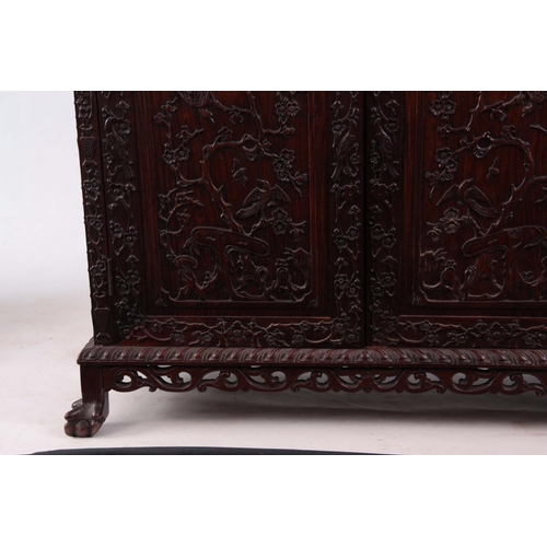 137 - AN IMPRESSIVE 19TH CENTURY CHINESE HARDWOOD DISPLAY CABINET having elaborately carved dragon pedimen... 