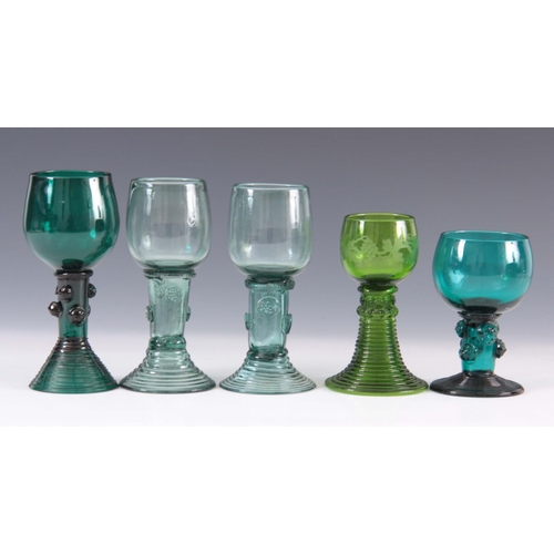 14 - A GROUP OF THREE 19TH CENTURY GREEN GLASS RUMMERS with rounded bowls on prunted flared ribbed bases ... 