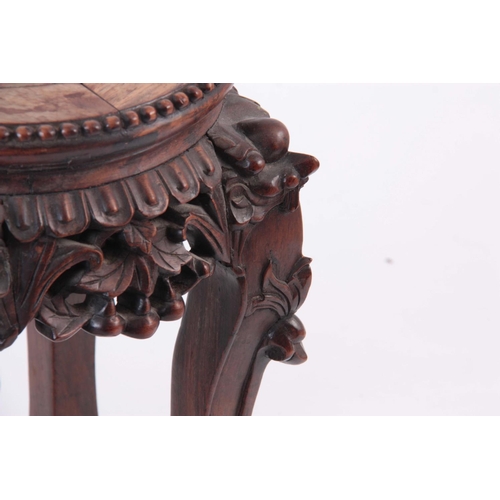 153 - A 19TH CENTURY CHINESE CARVED HARDWOOD JARDINIERE STAND with inset marble top 32cm high 28cm across.