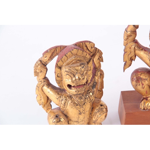 161 - THREE GILT CARVED ORIENTAL BUDDHAS 19cm high and smaller