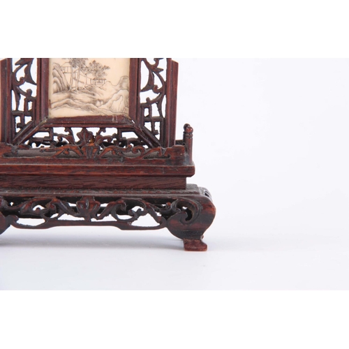 163 - LATE 19th CENTURY ORIENTAL TABLE SCREEN having a pierced rosewood frame enclosing an engraved ivory ... 