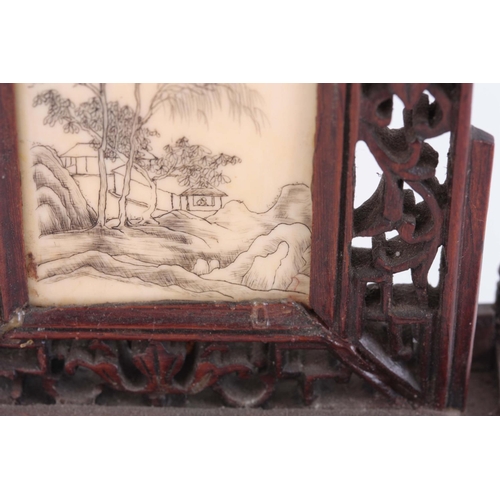 163 - LATE 19th CENTURY ORIENTAL TABLE SCREEN having a pierced rosewood frame enclosing an engraved ivory ... 