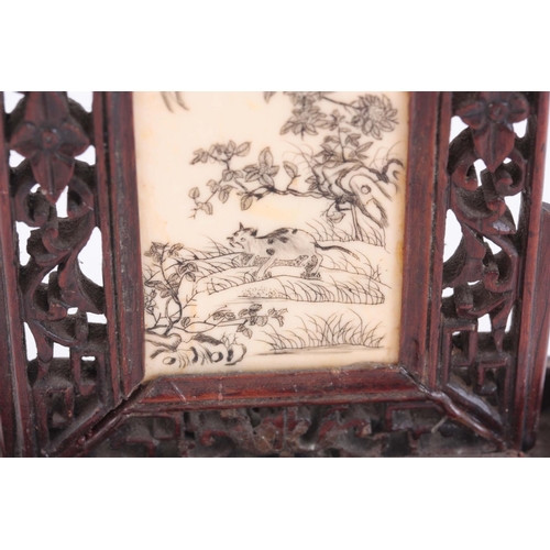 163 - LATE 19th CENTURY ORIENTAL TABLE SCREEN having a pierced rosewood frame enclosing an engraved ivory ... 