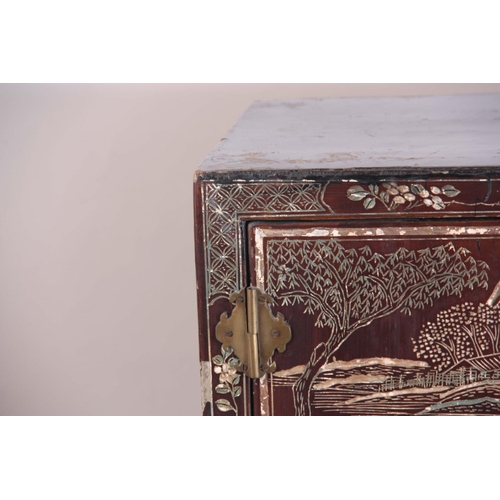 164 - AN EARLY 20TH CENTURY CHINOISERIE DECORATED LAQUERED CABINET having three sections the top two with ... 