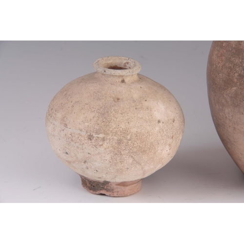 170 - THREE ANTIQUE CHINESE UNGLAZED STONEWARE VASES one of spherical shape 20cm, another ovoid with two s... 