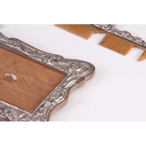 215 - A SELECTION OF VARIOUS SILVER ITEMS to include a dress set, mirror, frame etc. 10 items