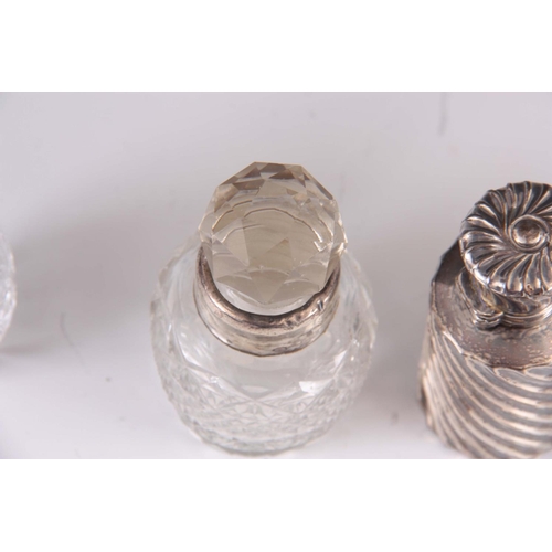 216 - A SELECTION OF 3 CUT GLASS AND SILVER BOTTLES and a silver scent bottle ( 4 )