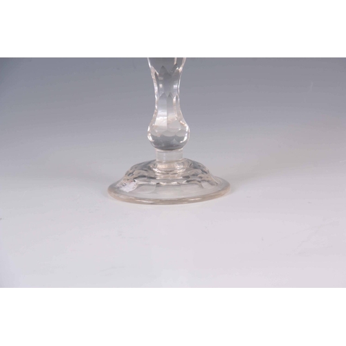 22 - AN 18TH/EARLY 19TH CENTURY CIRCULAR BASE FACET CUT GLASS PORT GLASS with knopped tapering stem and w... 