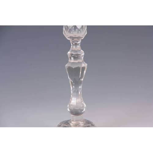 22 - AN 18TH/EARLY 19TH CENTURY CIRCULAR BASE FACET CUT GLASS PORT GLASS with knopped tapering stem and w... 