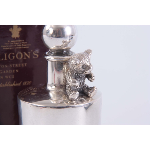 236 - A SILVER SCENT BOTTLE BY PENHALIGON'S, COVENT GARDEN, LONDON, with seated teddy bear decoration in o... 