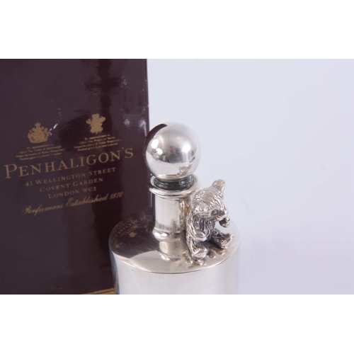 236 - A SILVER SCENT BOTTLE BY PENHALIGON'S, COVENT GARDEN, LONDON, with seated teddy bear decoration in o... 