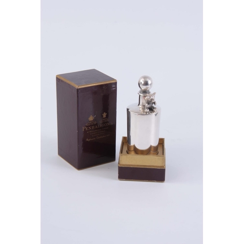 236 - A SILVER SCENT BOTTLE BY PENHALIGON'S, COVENT GARDEN, LONDON, with seated teddy bear decoration in o... 