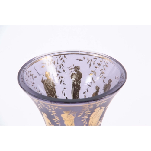 26 - A BACCARAT STYLE GLASS VASE WITH GILT ETCHED BAND OF CLASSICAL FIGURES having a chamfered cut knoppe... 