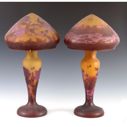 32 - A PAIR OF SHADED MAUVE AND YELLOW GLASS GALLE STYLE TABLE LAMPS AND MUSHROOM SHADES decorated flower... 