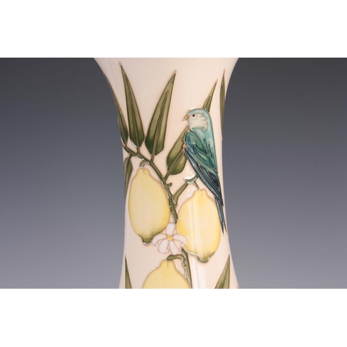 39 - A LATE 20TH CENTURY MOORCROFT POTTERY VASE decorated with lemons and birds on a cream ground, signed... 