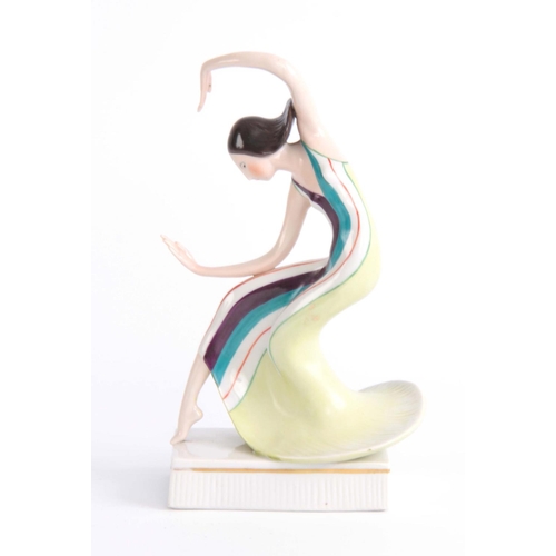 42 - A MID 20TH CENTURY ART DECO KATZHUTTE PORCELAIN FIGURE OF A DANCER wearing stiped green dress standi... 