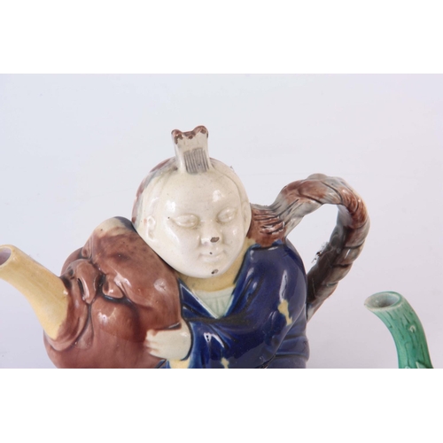 48 - TWO 19TH CENTURY MAJOLICA TEAPOTS, possibly Joseph holdcroft, one of a Chinese boy climbing on a mel... 