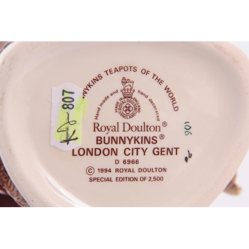 49 - A ROYAL DOULTON ÔBUNNYKINS LONDON CITY GENTÕ TEAPOT 21cm high together with a ÔWade Tessie BearÕ fig... 