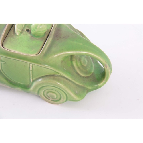 56 - A CIRCA 1930s SADLER RACING CAR TEAPOT, having a green glaze, baring registration number 820236 on t... 