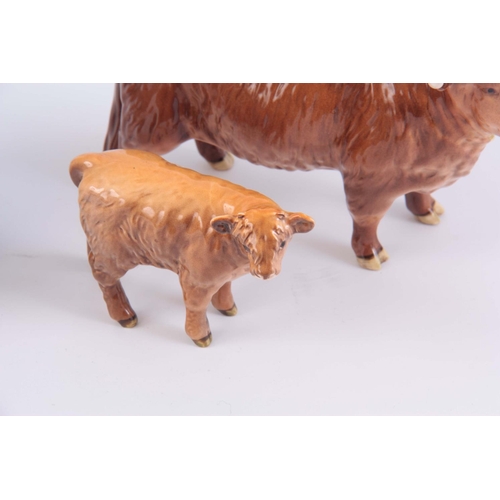 57 - A LATE 20TH CENTURY BESWICK POTTERY HIGHLAND COW AND CALF, 13cm high by 19cm wide, TOGETHER WITH A D... 