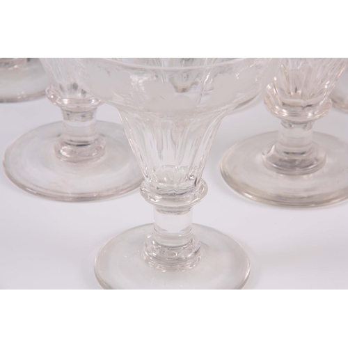 7 - A GOOD NEAR MATCHED SET OF ELEVEN 19TH CENTURY LARGE WINE GLASSES with fluted tapering rounded bowls... 