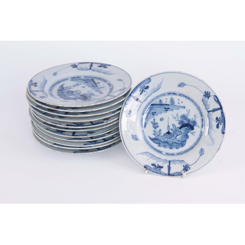 76 - A SET OF TWELVE 18TH CENTURY BLUE AND WHITE DELFT PLATES decorated with pagoda in a garden scene 23c... 