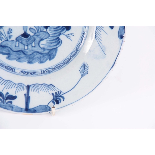 76 - A SET OF TWELVE 18TH CENTURY BLUE AND WHITE DELFT PLATES decorated with pagoda in a garden scene 23c... 