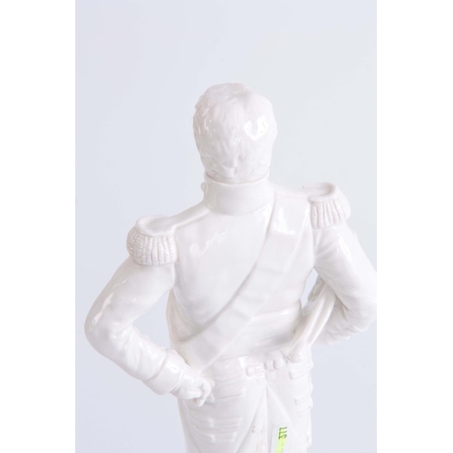 88 - 20TH CENTURY WHITE PORCELAIN FIGURE OF LORD NELSON standing on a base moulded as dominos - 37cm high... 