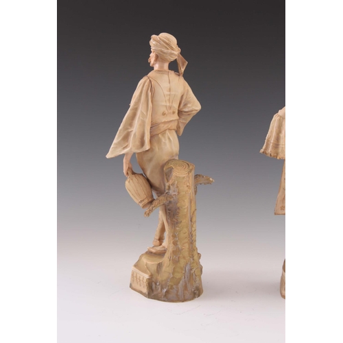 90 - A PAIR OF 19TH CENTURY ERNST WAHLISS AUSTRIAN PORCELAIN FIGURES of a man 38cm high and woman 40cm in... 