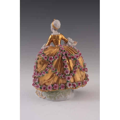 95 - A 20TH CENTURY SEVRES STYLE FIGURE OF A LADY in a gilded crinoline dress with applied roses 19.5cm h... 