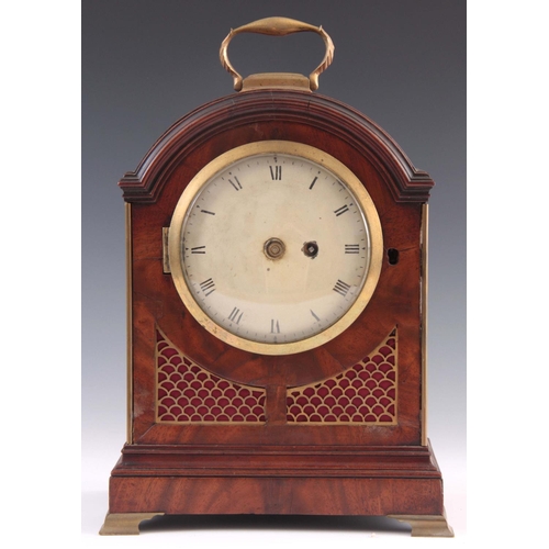 930 - A SMALL REGENCY FIGURED MAHOGANY BRACKET CLOCK the break arch case with brass fish scale frets and b... 