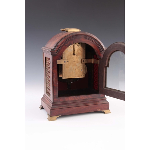 930 - A SMALL REGENCY FIGURED MAHOGANY BRACKET CLOCK the break arch case with brass fish scale frets and b... 