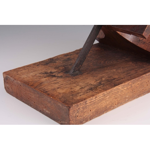 934 - AN UNUSUAL 18th/19th CENTURY ELM EQUINOCTIAL SUNDIAL of primitive form 35.5cm wide, 28cm high