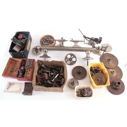 943 - A VINTAGE STEEL WATCHMAKERS LATHE with wheel cutting attachments and various components  42cm wide