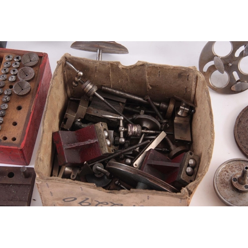 943 - A VINTAGE STEEL WATCHMAKERS LATHE with wheel cutting attachments and various components  42cm wide