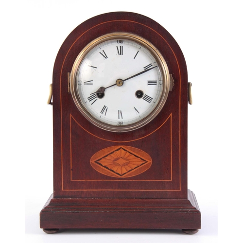 945 - AN EARLY 20th CENTURY ARCHED TOP MAHOGANY MANTEL CLOCK with inlaid decoration and convex porcelain d... 