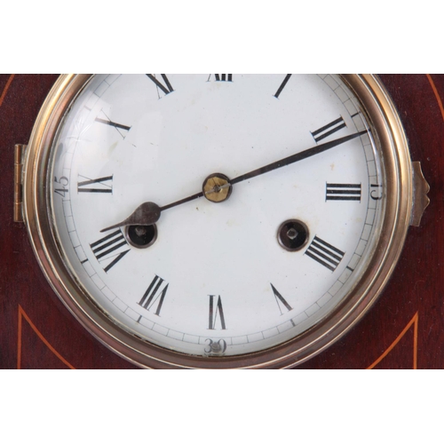 945 - AN EARLY 20th CENTURY ARCHED TOP MAHOGANY MANTEL CLOCK with inlaid decoration and convex porcelain d... 