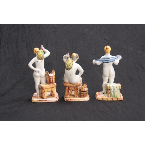 100 - A GROUP OF THREE RUSSIAN GLAZED TERRACOTTA NUDE FEMALE BATHERS 19cm high  and smaller